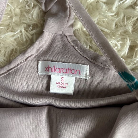 A shirt bundle with 5 tops (sizes include 1- XS, 3- smalls, and 1- medium) - Picture 7 of 11